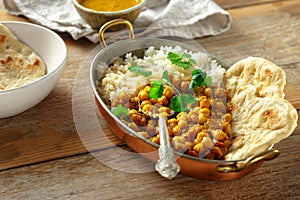 Asian lunch Asian food Chickpea curry rice quinoa pan wooden table healthy photo