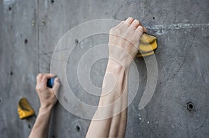 Asian male Climbing focus on hands