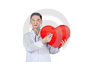 Asian male doctor auscultation a red heart with a stethoscope,