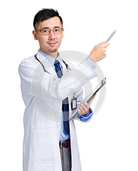 Asian male doctor with clipboard and pen indicate something