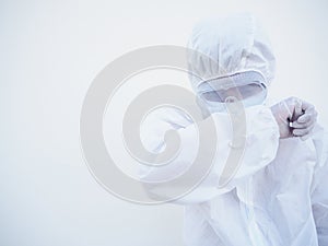 Asian male doctor or scientist in PPE suite uniform showing that feeling strees and sad. coronavirus or COVID-19 concept isolated