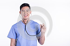 Asian male doctor smiling and using stethoscope while standing on white background