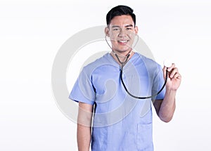 Asian male doctor smiling and using stethoscope while standing on white background