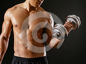 Asian male doing bicep curls