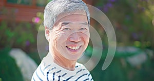 Asian male elder smiile at you