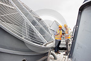 Asian male engineer inspecting pipe fittings and chillers, refrigeration plant refrigeration plant in  factory. male mechanic