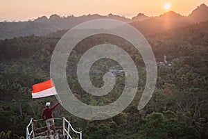 Asian male with indonesian flag celebrating independence day