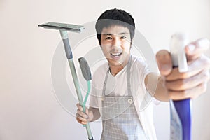 Asian male inspector smile to cleaning staff in bathroom disinfectant sprayers and germs  Metaphor for cleaning Get rid of germs