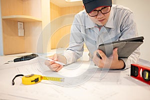 Asian male Interior worker working with construction tools