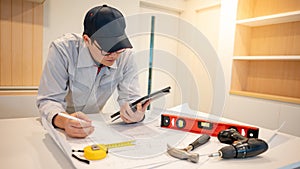 Asian male Interior worker working with construction tools