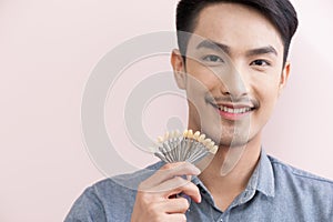 Asian male smiling in dental clinic