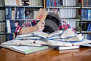 Asian male students are tired and stressed with reading a lot to prepare for the exam