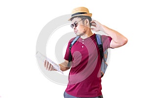 Asian male tourists Wearing dark glasses and wearing a hat and carrying a backpack Looking at the map and get confused with the