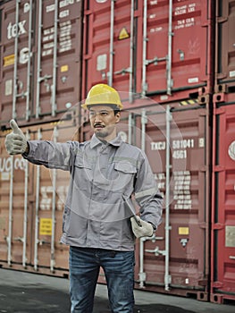 Asian male worker showing thumb as thank you or approval