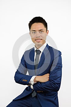 Asian man in blue suit cross arm