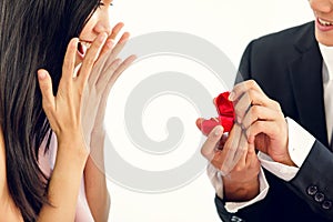 Asian man boyfriend give a box of ring to his girlfriend, she feels excited and very happy