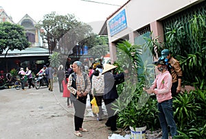 Asian man buying flowers in the market