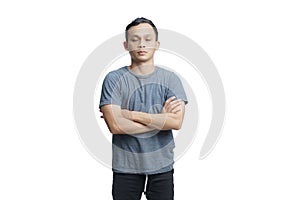 asian man close his eyes with arm crossed