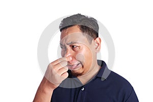 Asian Man Close His Nose Sick of Bad Smell