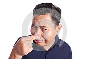 Asian Man Close His Nose Sick of Bad Smell