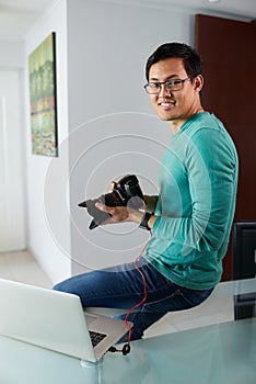 Asian Man Connect DSLR To PC Download Pictures On Laptop