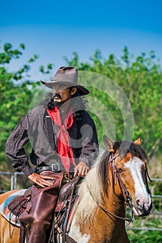 Asian Man Cowboy is catching calf To be branded in a ranch