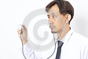 Asian man doctor diagnose with stethoscope on white background.