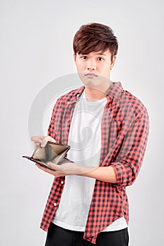 Asian man feel sad with wallet in hand on white isolated background