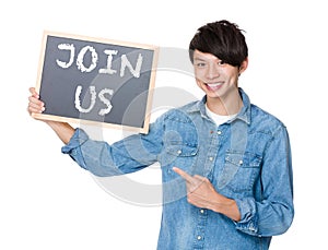 Asian man finger point to chalkboard and showing a phrases of jo