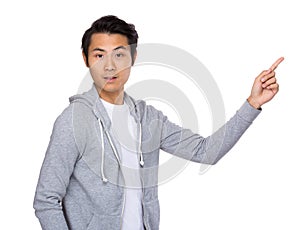 Asian man with finger point upwards