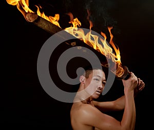 Asian man with fire show