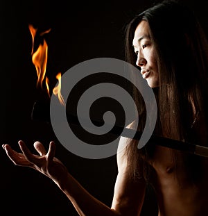 Asian man with fire show