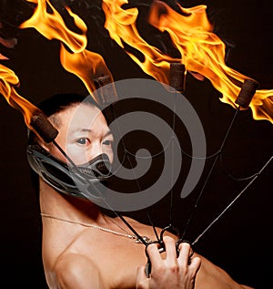 Asian man with fire show