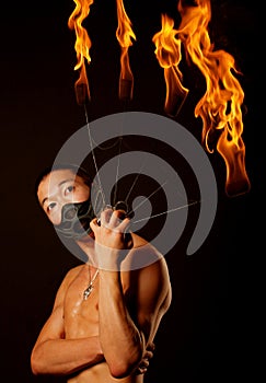 Asian man with fire show