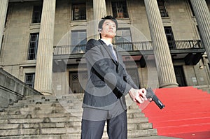 Asian Man with a Gun photo