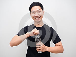 Asian man happy smile openning water bottle photo