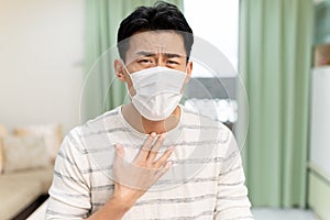 Asian man has sore throat