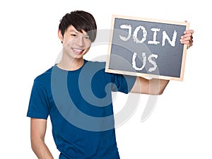 Asian man hold with blackboard and showing a phrases of join us