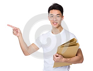 Asian man hold folder and finger point aside