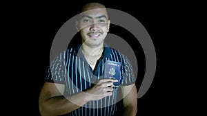 An Asian Man Holding Passport Isolated