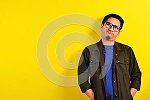 Asian Man with humorist face or funny face look at copy space photo