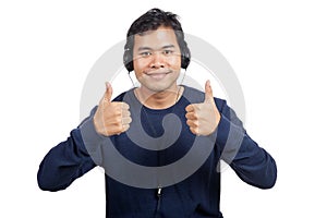 Asian man listen to music show thumbs up with both hands