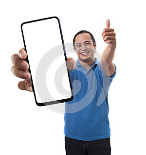 Asian man looking to camera, smiling and showing empty blank white copy space phone mock up template