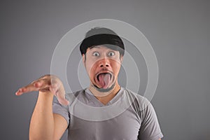 Asian man is making funny face.