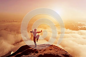 Asian man meditates in yoga position. Above clouds