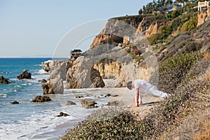 Asian man meditates in yoga position on high