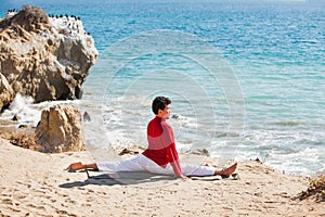 Asian man meditates in yoga position on high