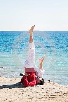 Asian man meditates in yoga position on high