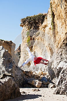 Asian man meditates in yoga position on high