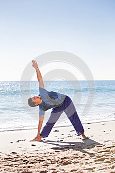 Asian man meditates in yoga position on high